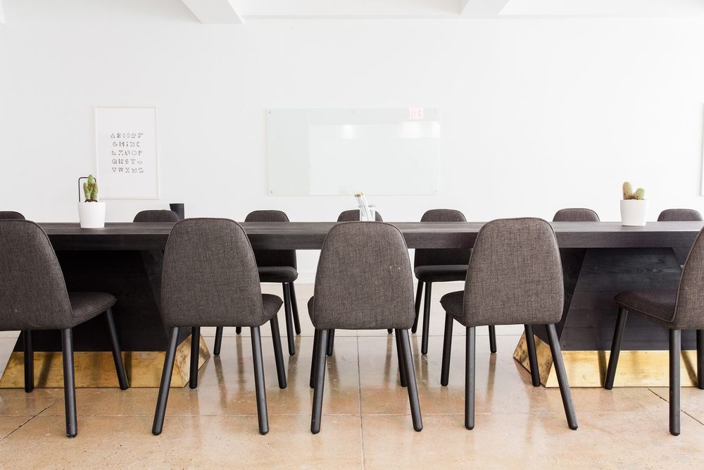 Long-table conference room with acoustic seating